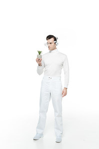 Cyborg in headphones and digital eye lens looking at potted plant on white background
