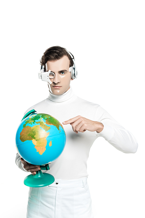 Cyborg in eye lens and headphones pointing at globe and  isolated on white