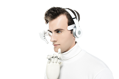 Cyborg with headphones, digital eye lens and artificial hand looking away isolated on white