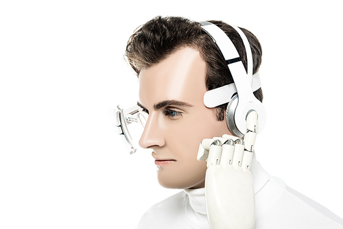 Cyborg in eye lens touching headphones with artificial hand isolated on white