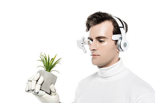 Cyborg in headphones and digital lens holding plant in artificial hand isolated on white