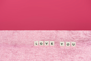 cubes with love you letting on velour pink cloth isolated on pink, girlish concept