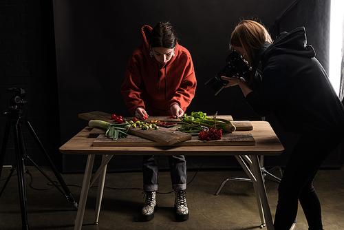 commercial photographers making food composition for taking photo on digital camera