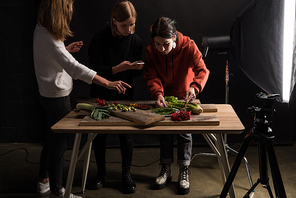 photographers making food composition for commercial photography on smartphone