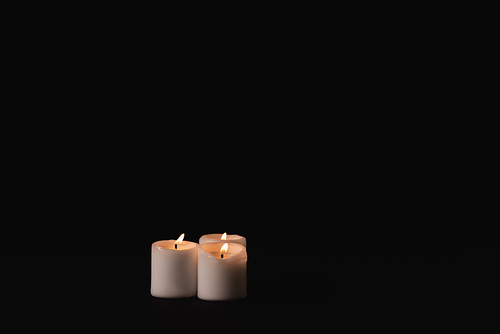 burning candles on black background, funeral concept