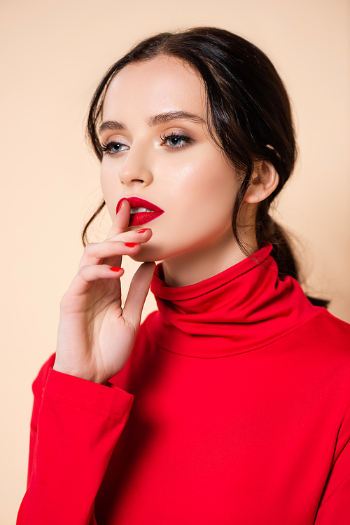 brunette young woman with red lips showing hush sign isolated on pink