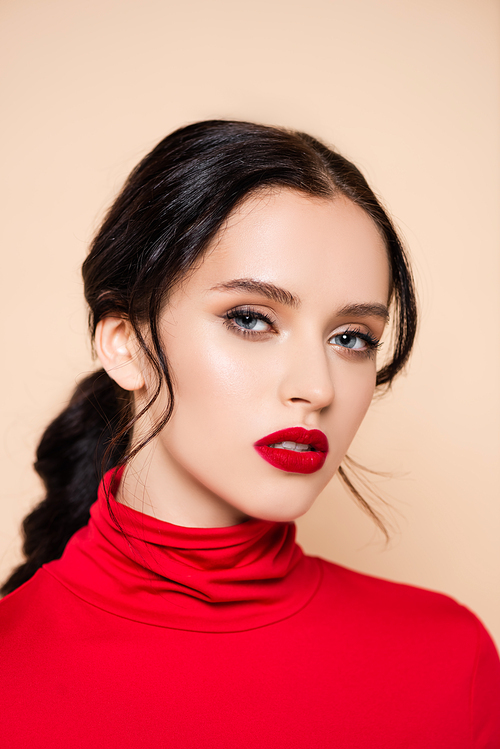 brunette woman with red lips  isolated on pink