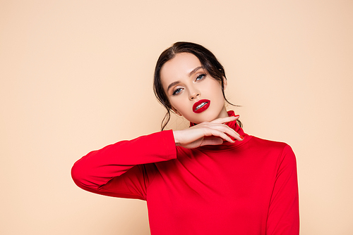 brunette young woman with red lips posing and  isolated on pink
