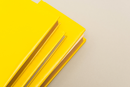 yellow copy books isolated on grey with copy space