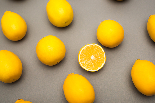 high angle view of yellow lemons on grey background