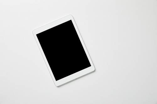 top view of digital tablet on white surface