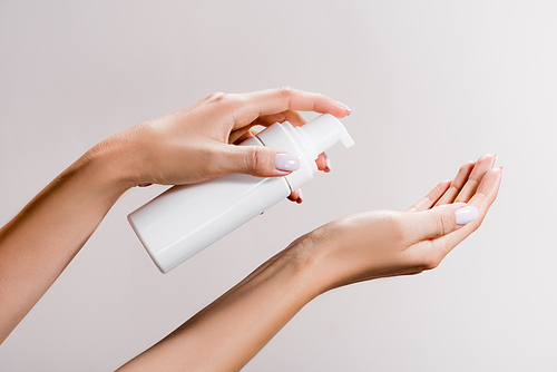 cropped view of woman applying cleansing foam isolated on grey