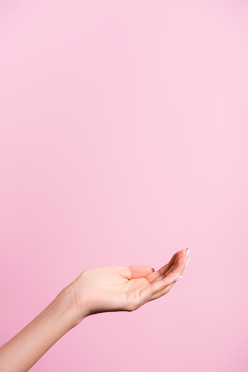 cropped view of female hand isolated on pink