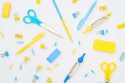 mix of blue and yellow stationery on white background