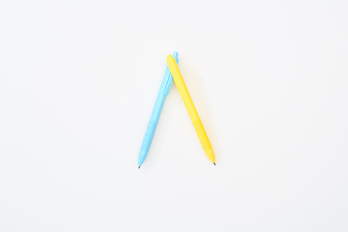 top view of yellow and blue pencils isolated on white