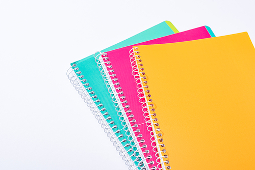 high angle view of colorful notebooks isolated on white