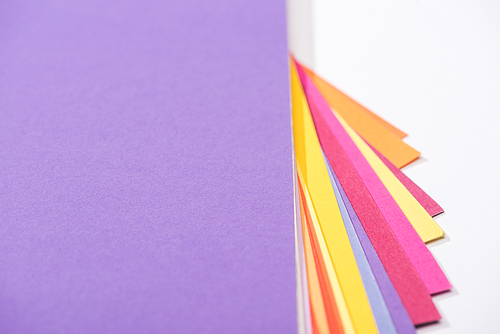 high angle view of  bright and colorful papers on white background