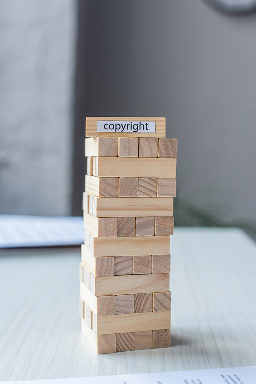 Blocks wood tower game with copyright lettering on blurred background
