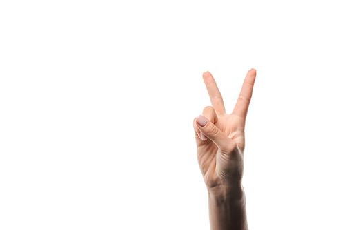 cropped view of woman showing peace sign isolated on white
