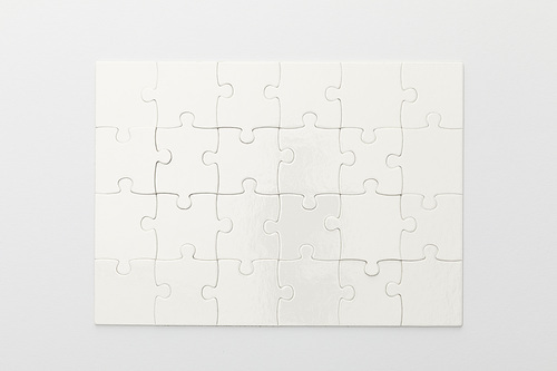 top view of completed jigsaw puzzle on white background