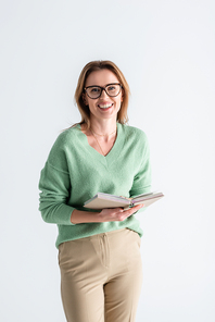 cheerful woman in glasses holding book isolated on white