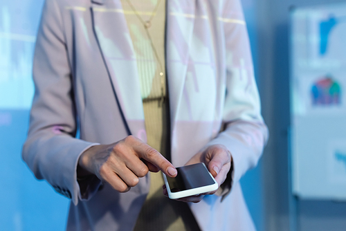 partial view of businesswoman pointing with finger at smartphone with blank screen
