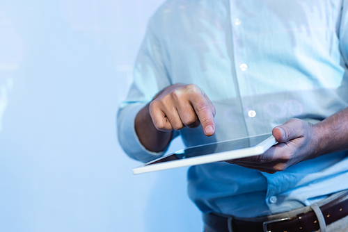 partial view of businessman pointing with finger at digital tablet with blank screen