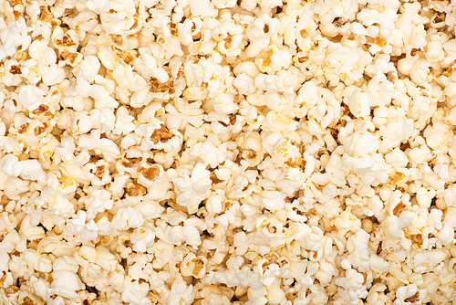 background with airy popcorn, top view, cinema concept