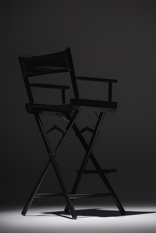 black director chair on dark grey background, cinema concept