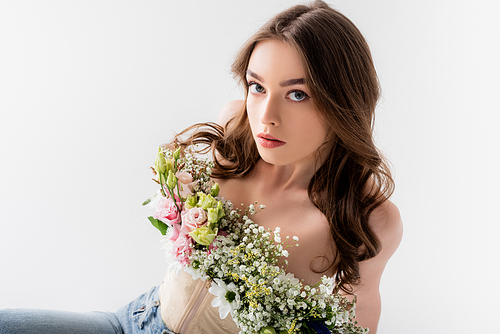 High angle view of young woman with flowers in blouse  isolated on grey
