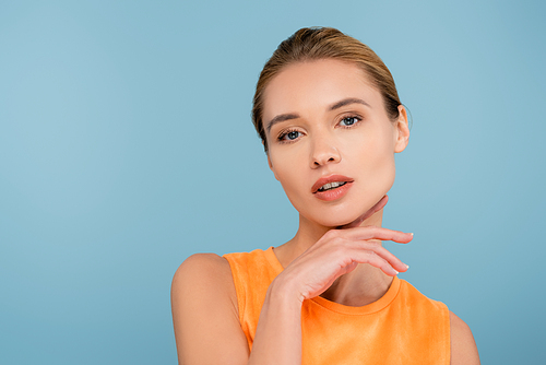 sensual woman with natural makeup  isolated on blue