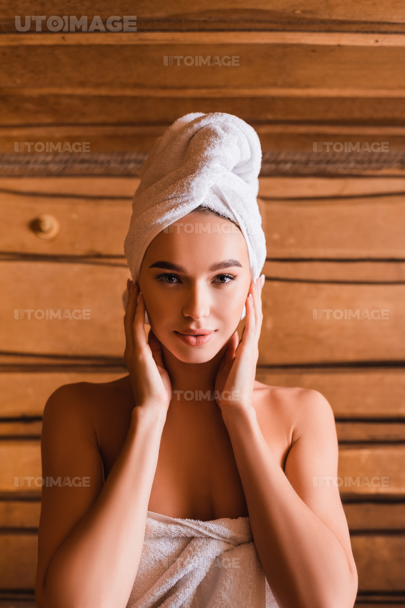 young-woman-in-white-towels-in-sauna