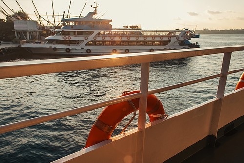 Lifebuoy on ship railing with sea during sunset at background, Istanbul, Turkey