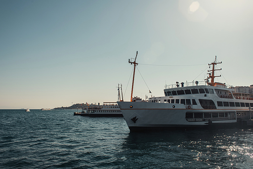 blue, cloudless sky over vessels floating on Bosphorus strait
