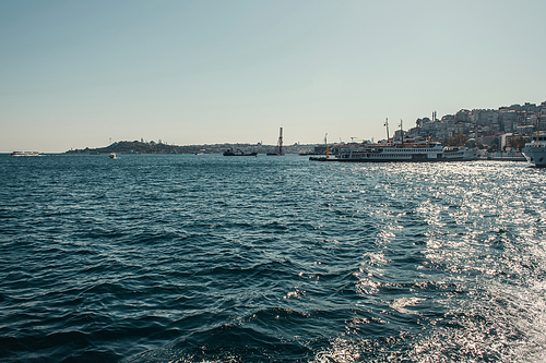 view of moored ships and city from Bosphorus strait, Istanbul, Turkey