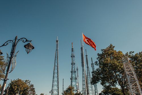 turkish flag and forged lantern near tv towers