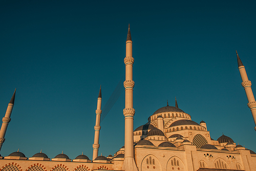 blue, cloudless sky over Mihrimah Sultan Mosque with high minarets, Istanbul, Turkey