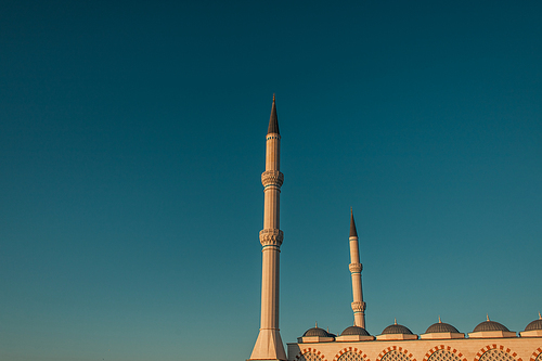 blue, cloudless sky over high minarets of Mihrimah Sultan Mosque, Istanbul, Turkey