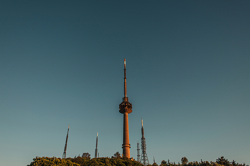 tv and radio towers against cloudless sky