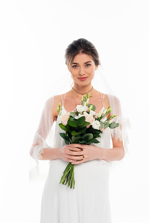 happy, pregnant bride  while holding wedding bouquet isolated on white