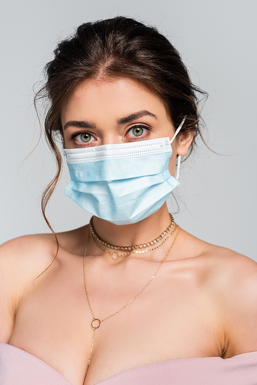 young bride in medical mask  isolated on grey