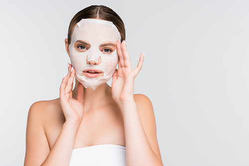 young woman with moisturizing sheet mask isolated on white