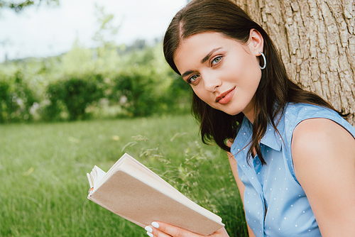 beautiful woman holding book and 