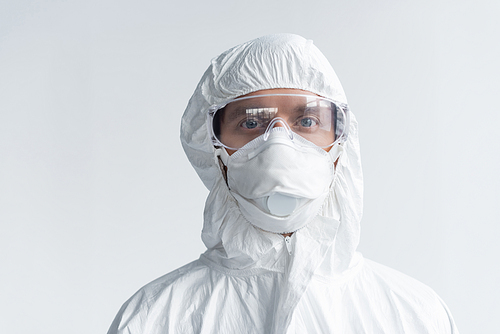 Scientist in protective uniform and mask  isolated on grey