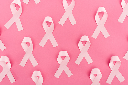 top view of pink breast cancer signs, seamless background