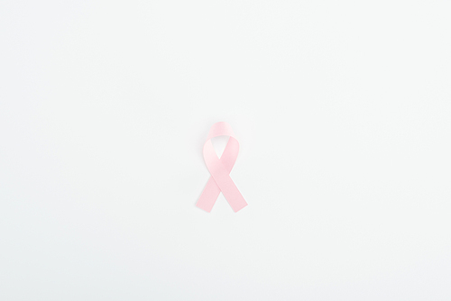 top view of pink breast cancer sign on white background