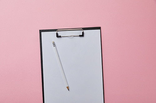 pencil on folder with empty paper isolated on pink