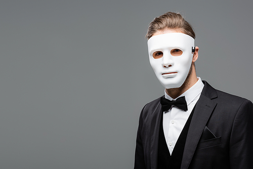 young businessman in face mask  isolated on grey