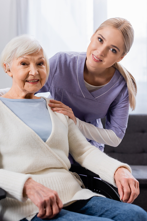 happy nurse and senior . woman smiling while