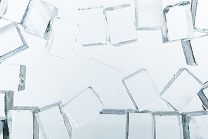 top view of transparent clear square ice cubes on mirror